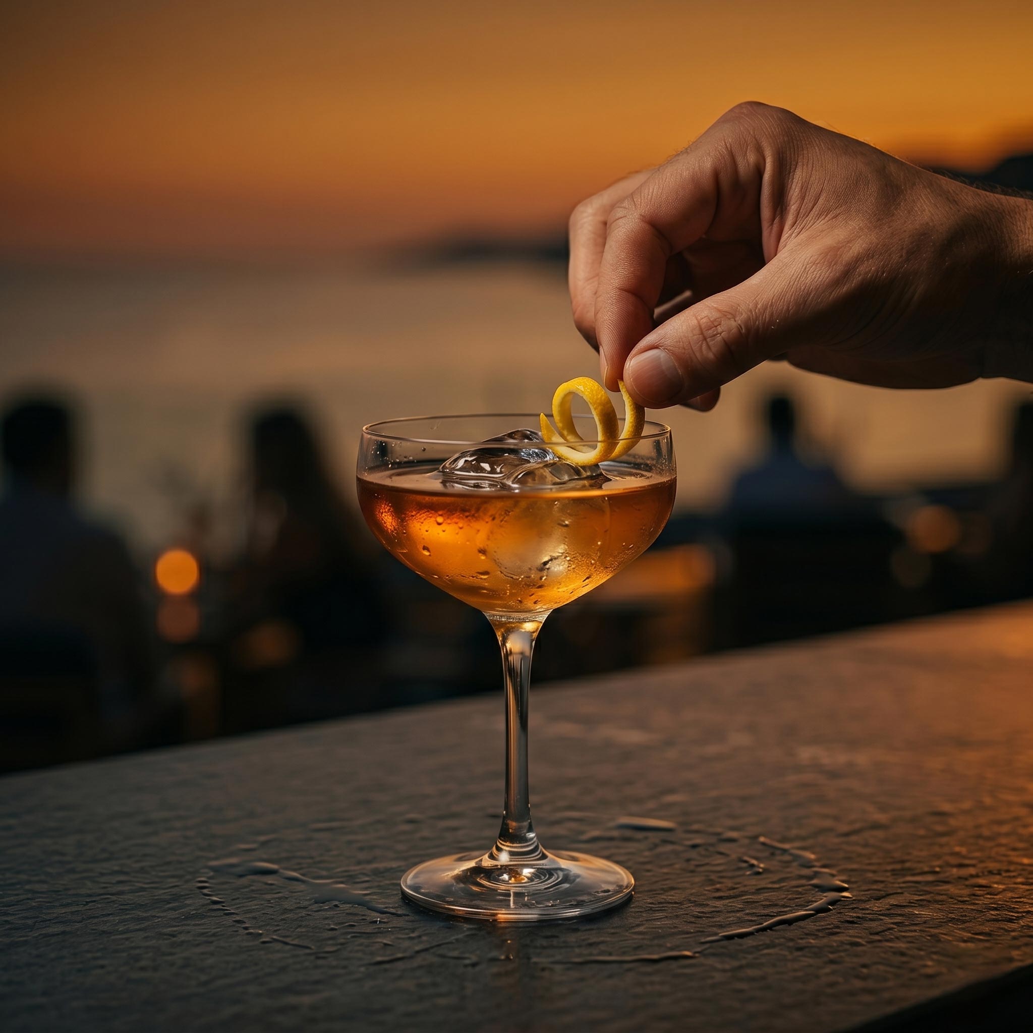 Signature cocktail at UMI during golden hour on the rooftop